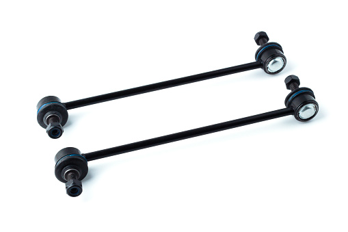 Spare parts for chassis repair. Stabilizer struts of a passenger car isolated on a white background