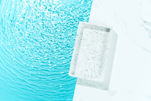 istock Minimalist cosmetics product presentation mockup scene made with mosaic tray adorned with blue water, creating a sleek and elegant visual appeal. Perfect for showcasing beauty products. 2148726821
