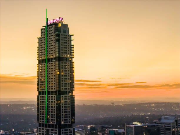 Leonardo hotel building being the highest in South Africa seen at sunset in Sandton. Sandton has become home to most of the major financial, consulting and banking firms in South Africa, it houses approximately 300000 residents and 10 000 businesses, including investment banks, top businesses.