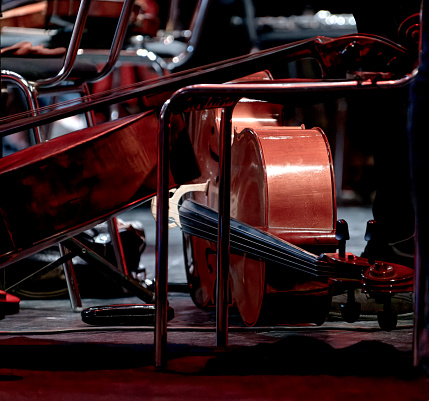 An image of a cello lies during intermission on the theater stage
