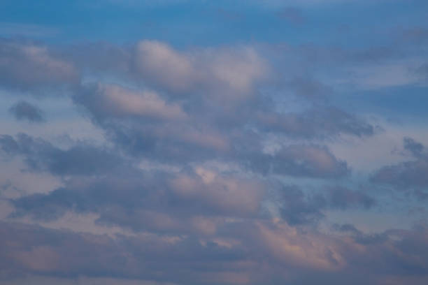 istock Clouds in the light of the setting sun, evening light on the clouds in the sky 2148731385