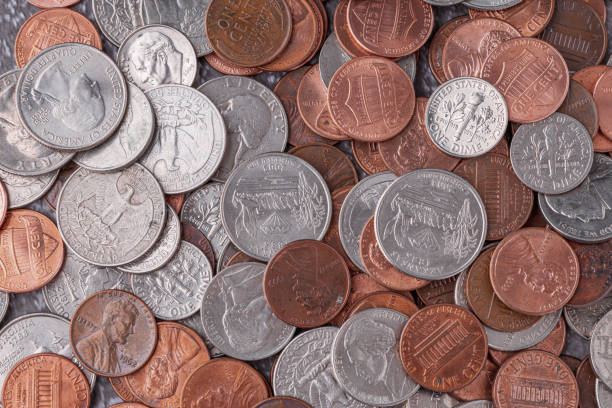 istock American coins and US dollars on a wooden table 2148734559
