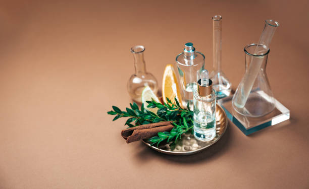 Perfumery workshop with various ingredients, citrus fruits, essential oils, spices, laboratory tubes illustrating the concept of creating fragrance with citrus notes.