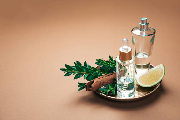istock Aromatherapy and perfumery concept with cinnamon sticks, lime and essential oils, showcasing natural ingredients commonly used for aromatic products. Background with copy space. 2148735262