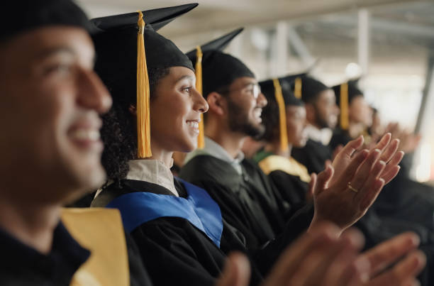 istock Student, university and graduation clapping or ceremony celebration of education achievement, scholarship or college. Men, woman and diversity applause or academy support or study, victory or event 2148736128