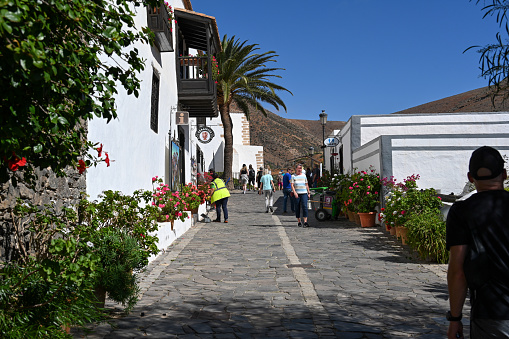 Betancuria, Fuerteventura, Spain, February 16, 2024 - Tourists stroll through the historic old town of Betancuria, Fuerteventura.