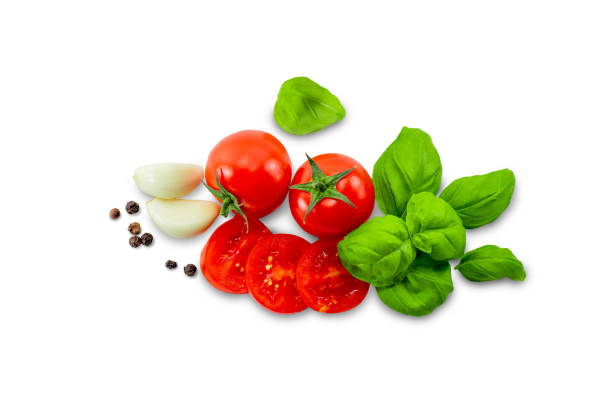 istock Ripe red tomatoes, sliced, basil, garlic and pepper on a white background isolate 2148737791