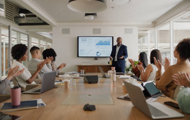 istock Boardroom, data and clapping for presentation by executive for team on meeting for business. Man, training and mentor of employees or staff, office and laptop for internet, technology and sales 2148737963