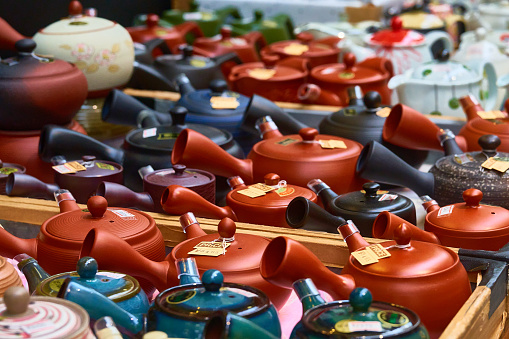 Colorful teapots lined up in the store