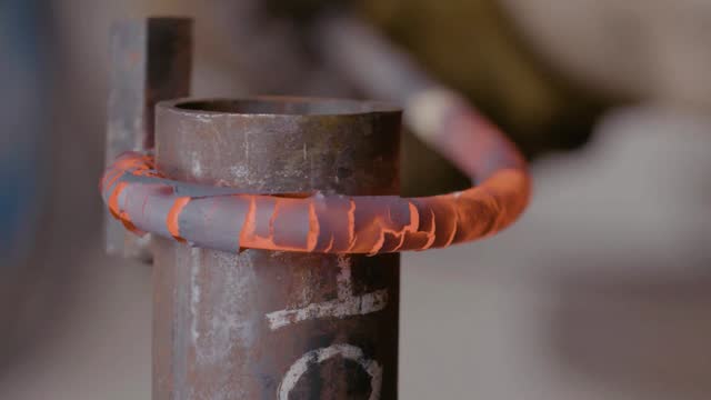 Blacksmith forging hot iron on the anvil stock video