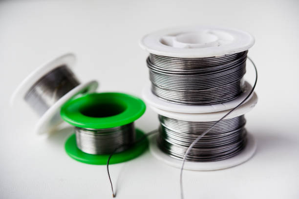 istock Tin-lead solder in coils on a white background. Materials for soldering. 2148739385