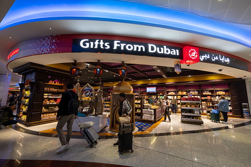 Dubai, United Arab Emirates - March 31, 2024 : People at the Duty Free Shop in Dubai International Airport.