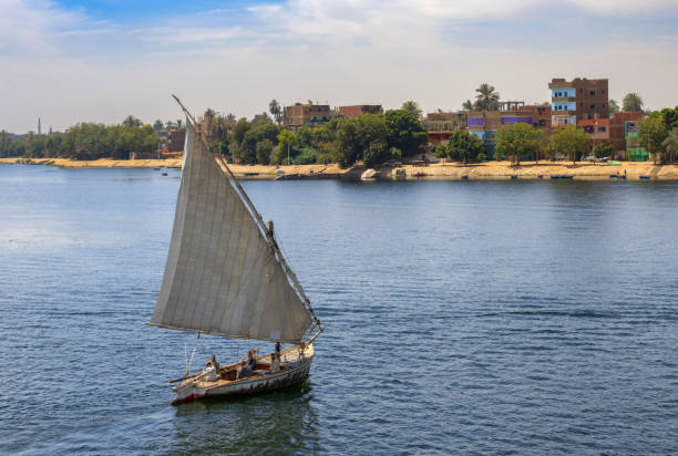 Traditional sailing boat near white sand beach, from high rocks, north of Toliara on South West coast of Madagascar. It is on right up corner of photo
