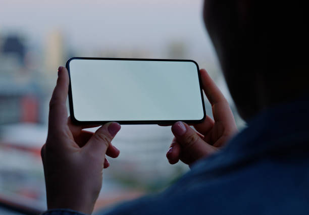 istock Phone screen, hands and person with mockup space for social media, information or reading email in city. Closeup, digital display or show mobile smartphone for advertising, marketing or woman on app 2148741331