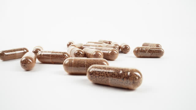 Herbal Capsules on White Background