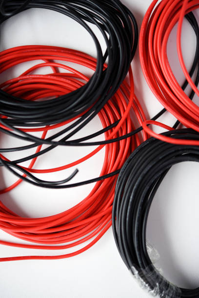 istock Wires for electronics on a white background. Two coils of red and black wires. 2148742685