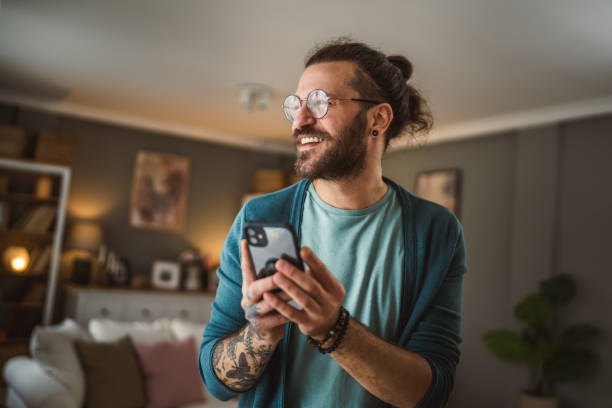 istock man with eyeglasses write message or browse internet hold mobile phone 2148743864