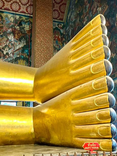 Wat Pho's famous golden Reclining Buddha is nearly 50 meters long and 15 high and is covered in gold leaf and has feet made of mother of pearl.