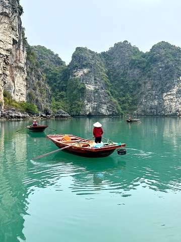 Local fishermen in Halong Bay, Vietnam, Southeast Asia. UNESCO World Heritage Site