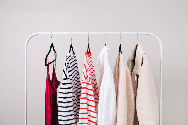 istock Wardrobe essentials, stylish woman's closing on the rack 2148744704