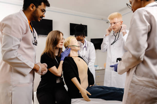 istock Group of doctors examining medical dummy 2148746063