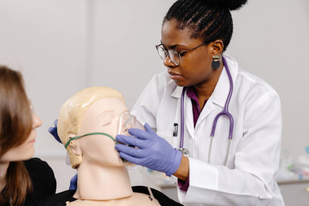 istock A doctor puts an oxygen mask on a mannequin at a first aid course 2148746064