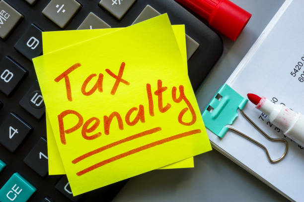 istock Tax penalty concept. Calculator with a sticker on it. 2148746791