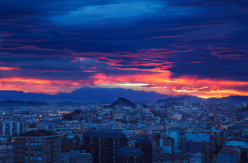 Night falls in the city of Santander with a spectacular sky enveloping the silhouette of the Picos de Europa
