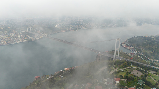 Aerial view of The Second Bosphorus Bridge or Fatih Sultan Mehmet Bridge, Istanbul in a foggy day.