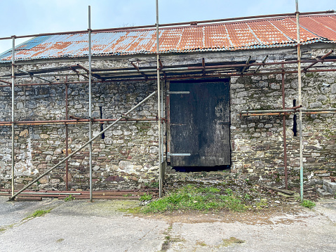 Old cowshed with scaffolding