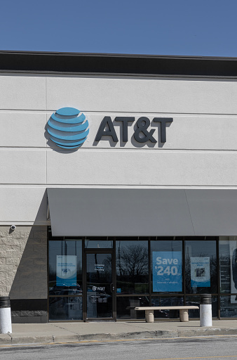 Indianapolis - April 13, 2024: AT&T cell phone retail store. AT&T offers voice, data, cellular, mobile, fiber optics, TV and IP-based products.