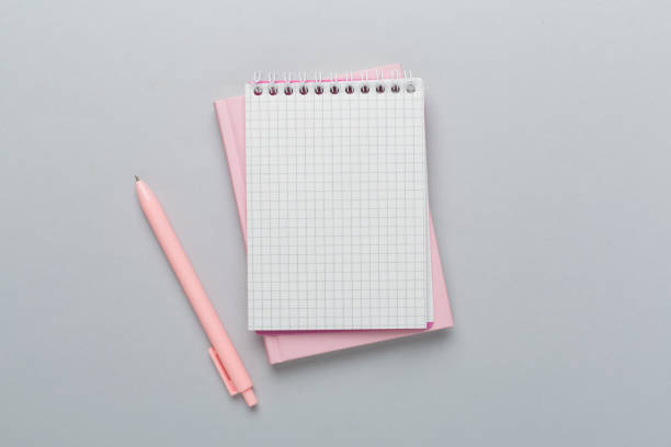 istock Notebooks with stationery on color background, top view 2148747756