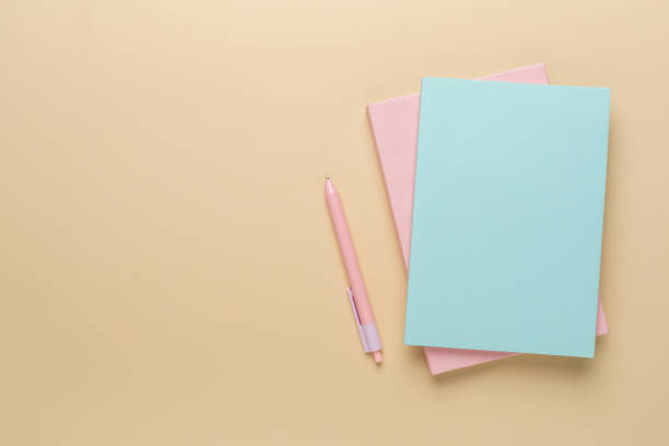 istock Notebooks with stationery on color background, top view 2148747763