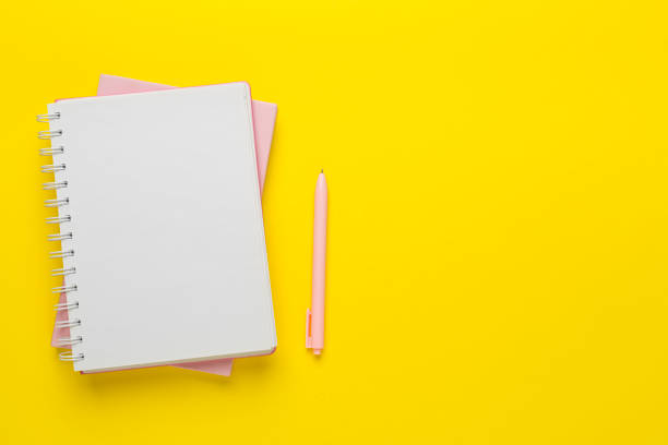 istock Notebooks with stationery on color background, top view 2148747765