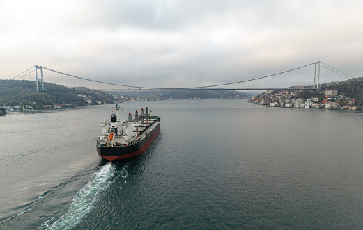 Aerial view of Large Bulk Carrier in transit. Istanbul Bosphorus.  Aerial view of general cargo ship logistic and transportation business in Istanbul Bosphorus.