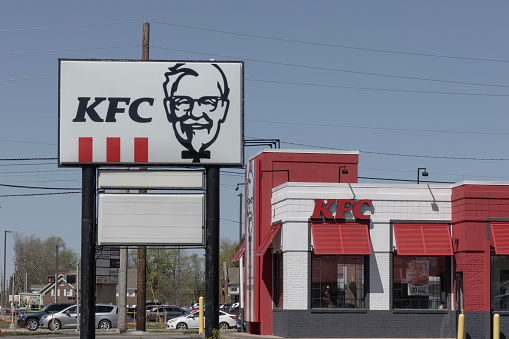 Greenwood - April 13, 2024: KFC Fried Chicken restaurant. Kentucky Fried Chicken is offering Uber and Door Dash delivery and drive thru service.