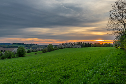 Evening near Roprachtice village in cloudy sunny evening with sunset