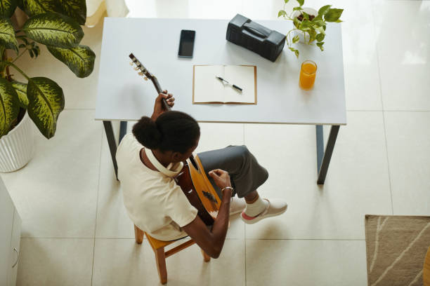 istock Creative Black Girl Playing Guitar 2148749281
