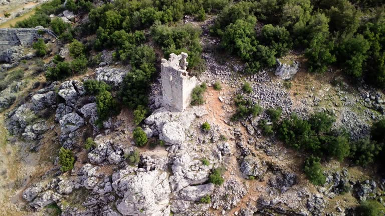 Panoramic aerial view of Olba, the ruins of an ancient watchtower that guarded the main gate of the ancient Roman city in Turkey. Explore Olba, an ancient watchtower, in drone footage