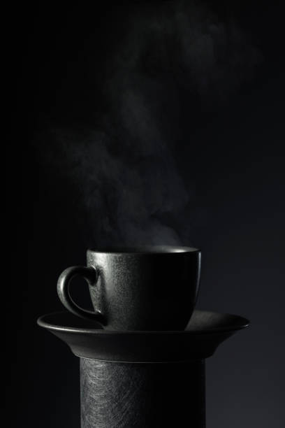 istock Black cup of coffee on a black background. 2148750717