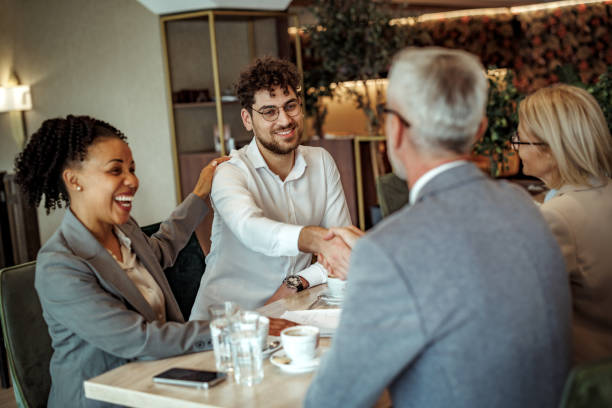 istock Business partners shaking hands during coffee break at the restaurant 2148751396