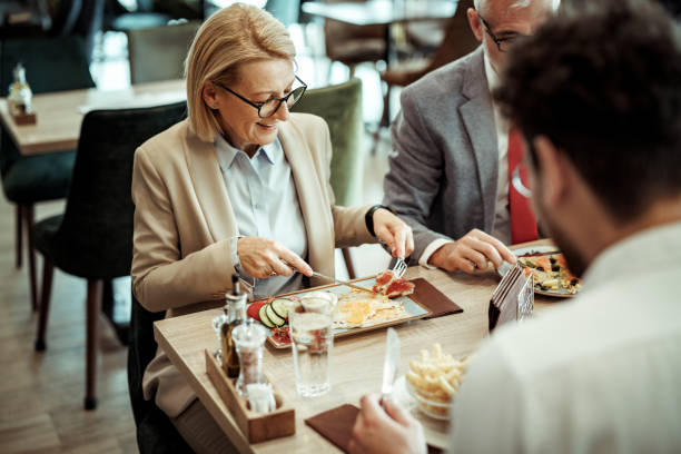 istock Colleagues having lunch together at the restaurant 2148751416