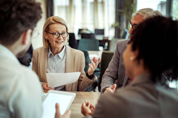 istock Coworkers talking during coffee break at the restaurant 2148751567