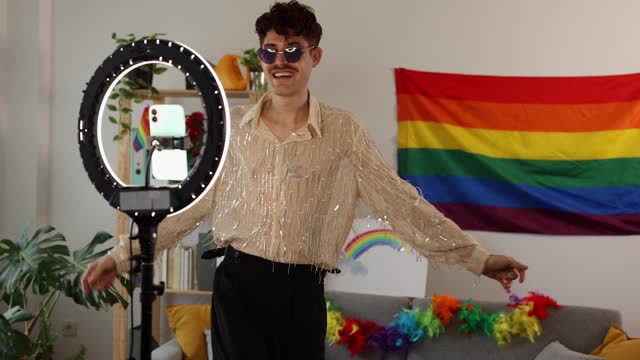 glamorous man films himself dancing for his social networks on the occasion of the gay pride party