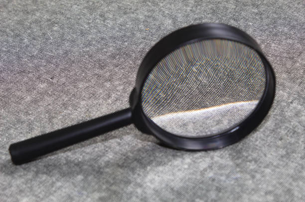 Single magnifying glass isolated on white background