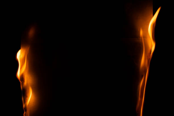 burning paper, glowing edge of paper on a black background