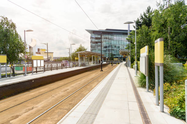 Tram stop in a suburban business district on a cloudy summer day