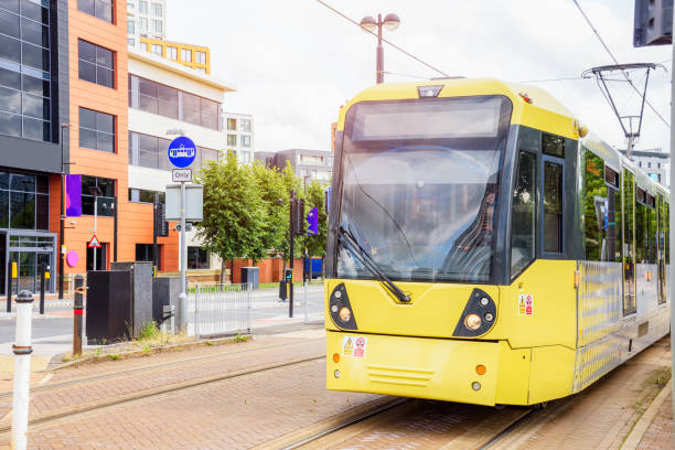 istock Yellow tram on separated tramway in a suburban district 2148757203