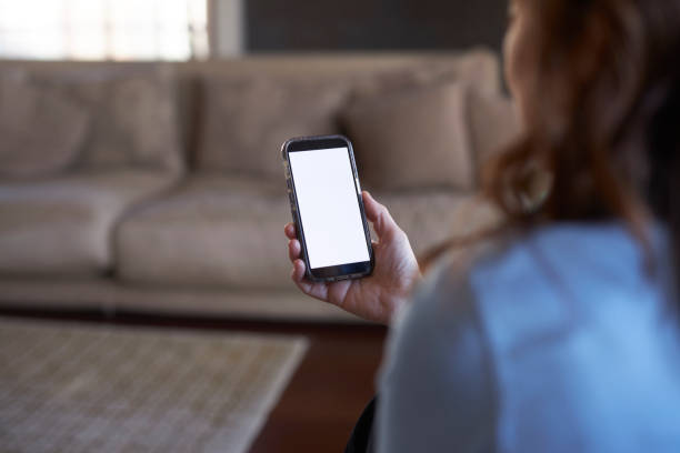 istock a long haired lady holding mobile phone at hand 2148757887