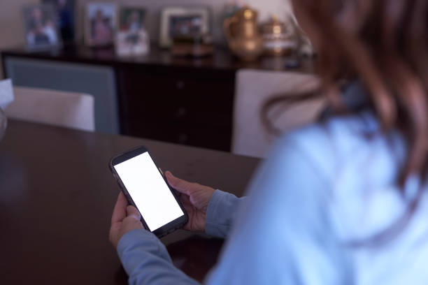 istock a long haired lady holding mobile phone at hand 2148758018